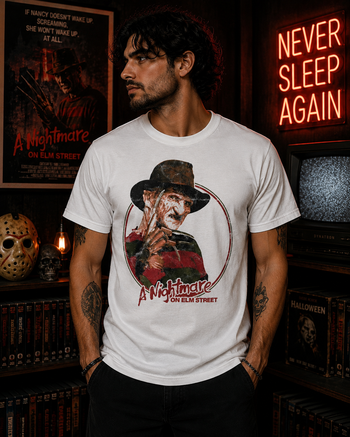 Male model wearing a white Nightmare on Elm Street Freddy Krueger t-shirt in a dark horror movie room with vintage slasher decor.