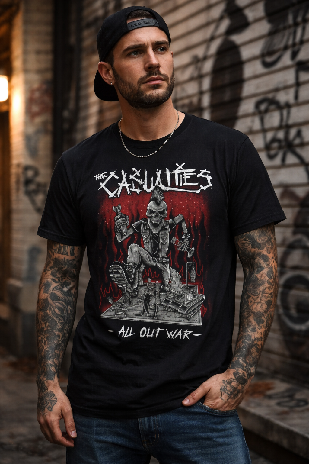 male model wearing The Casualties All Out War t shirt with skull graphic in urban street punk setting