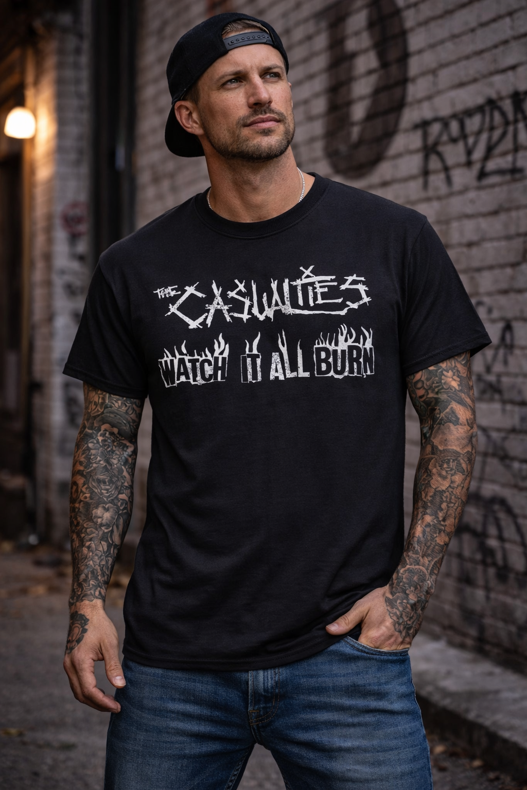 male model wearing The Casualties Watch It All Burn front print punk band t shirt in streetwear style