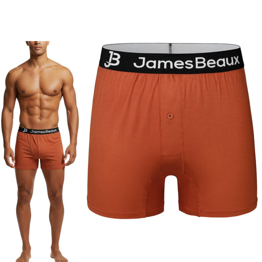 Red men's underwear with black waistband featuring 'James Beaux' logo, worn by a model.