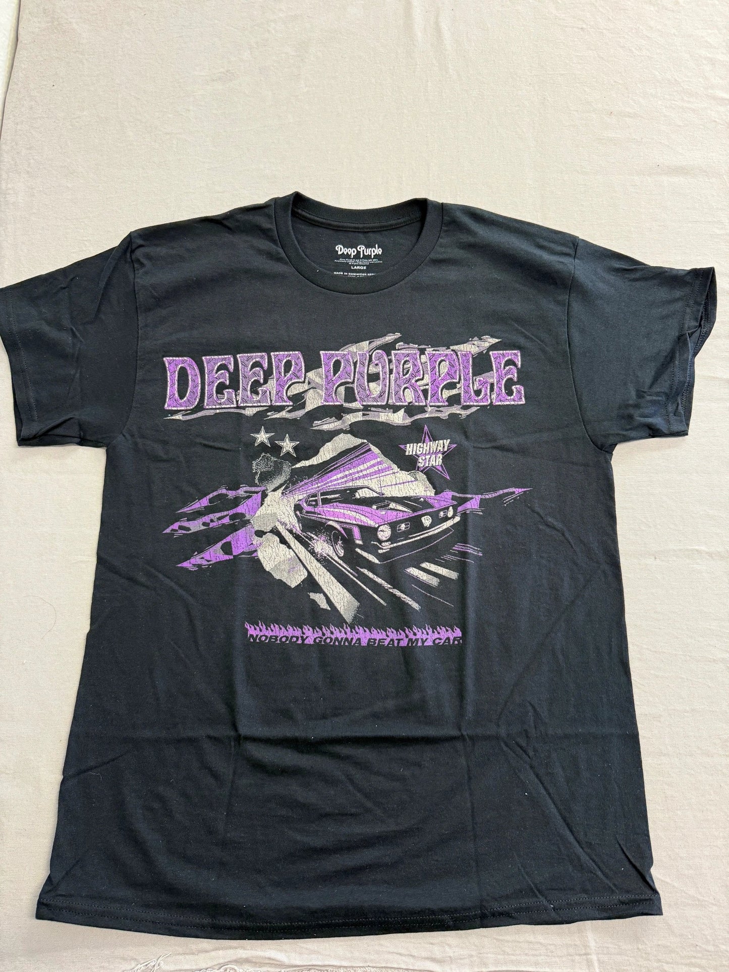 Black t-shirt with 'Deep Purple' band graphic on a light gray background