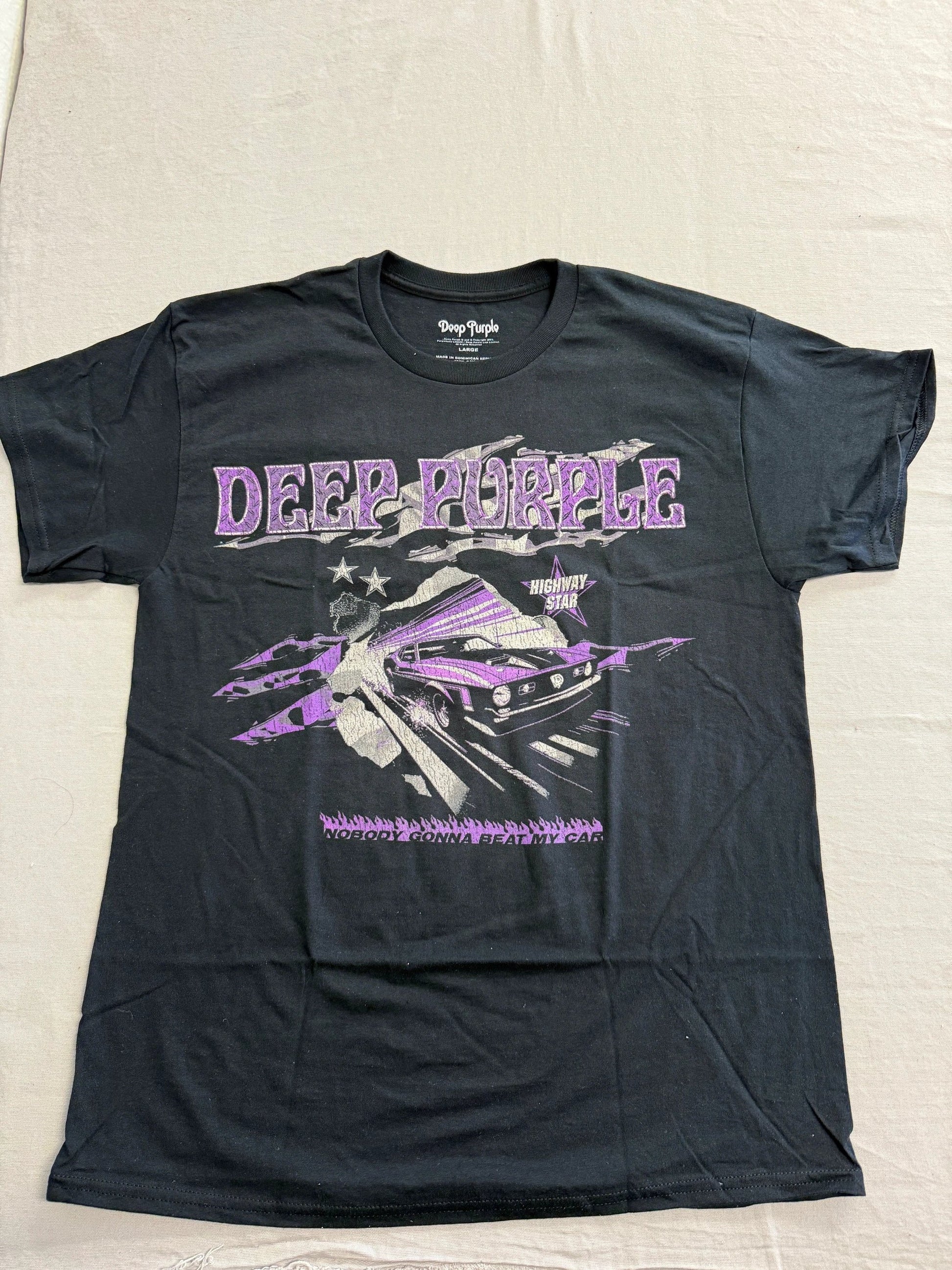 Black t-shirt with 'Deep Purple' band graphic on a light gray background