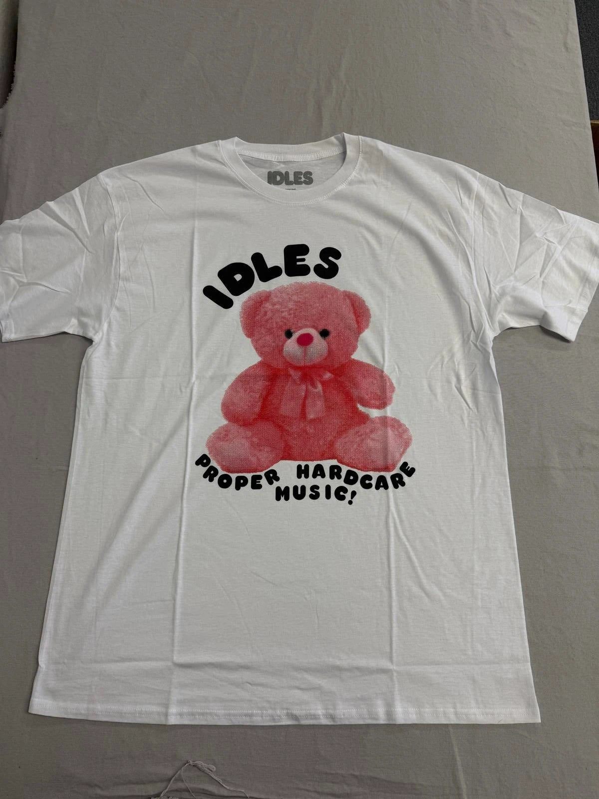 IDLES band T-shirt featuring “Proper Hardcore Music” pink teddy bear graphic artwork