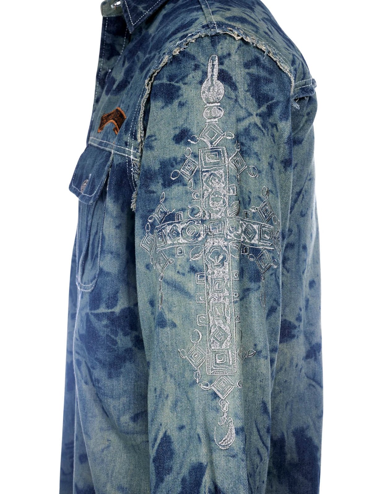 Close-up left side of Veneno skull denim jacket showing vintage hand-washed cotton denim and distressed streetwear detailing