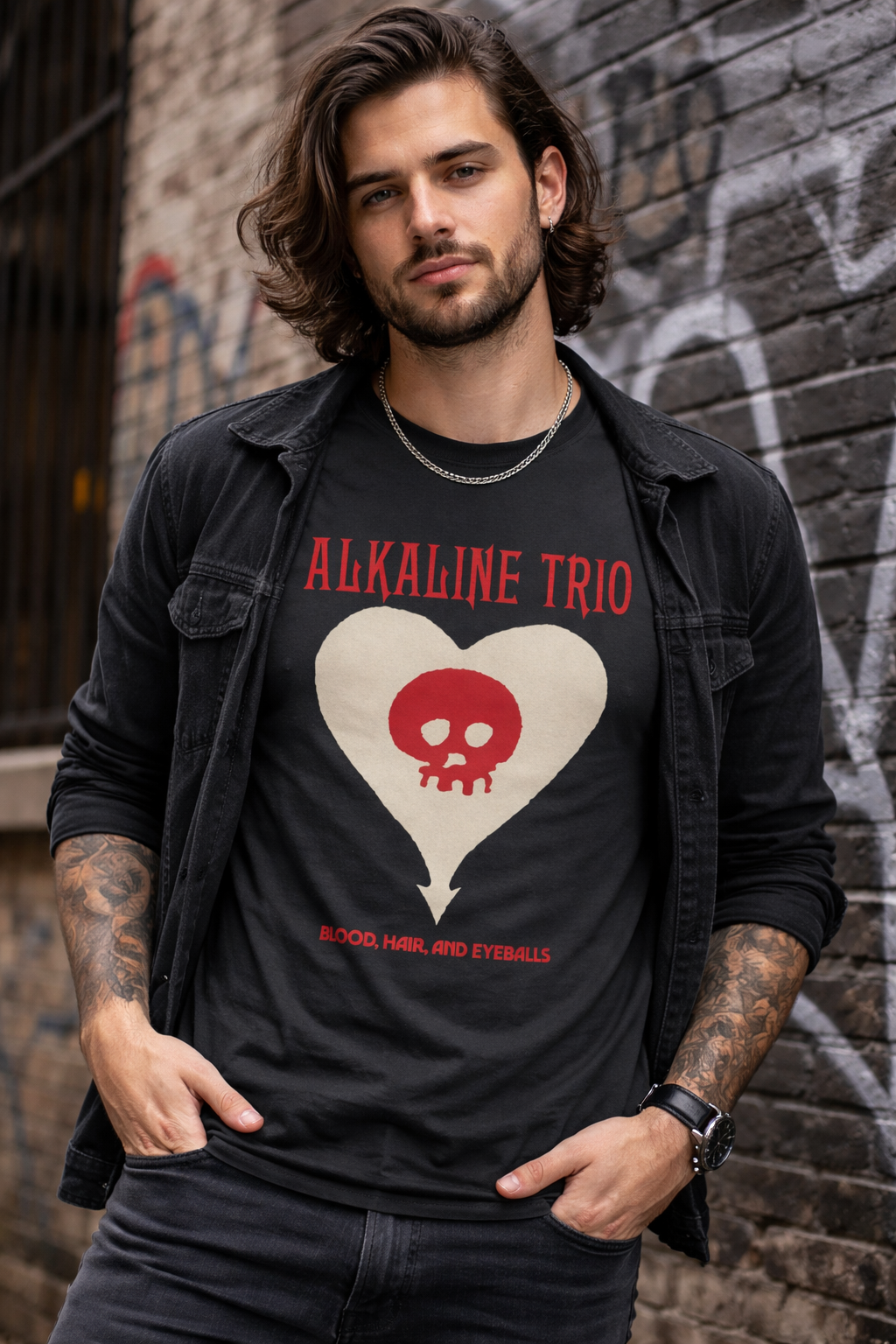 Male model wearing Alkaline Trio Heartskull black t shirt with skull heart logo in urban street style setting