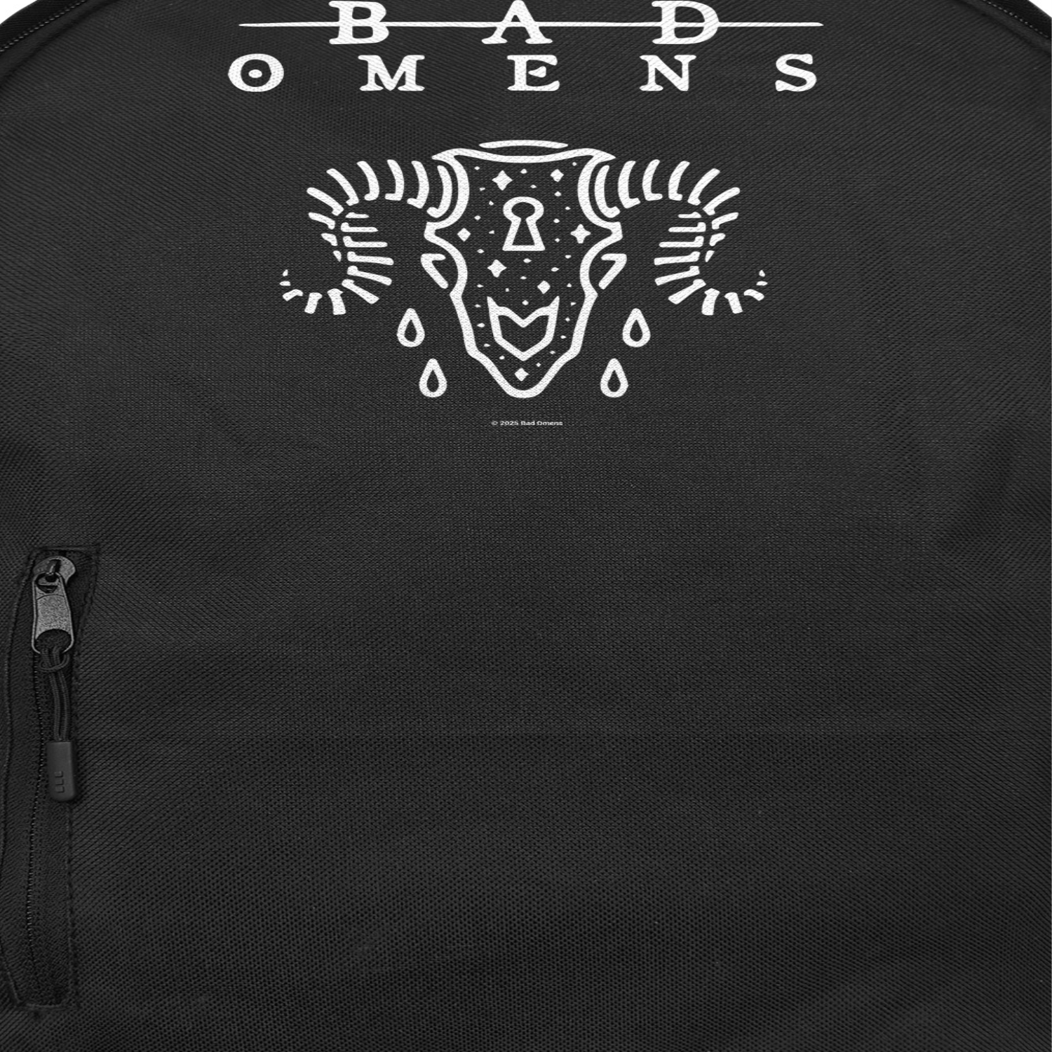 Close up of Bad Omens Ramskull backpack with minimalist skull graphic design