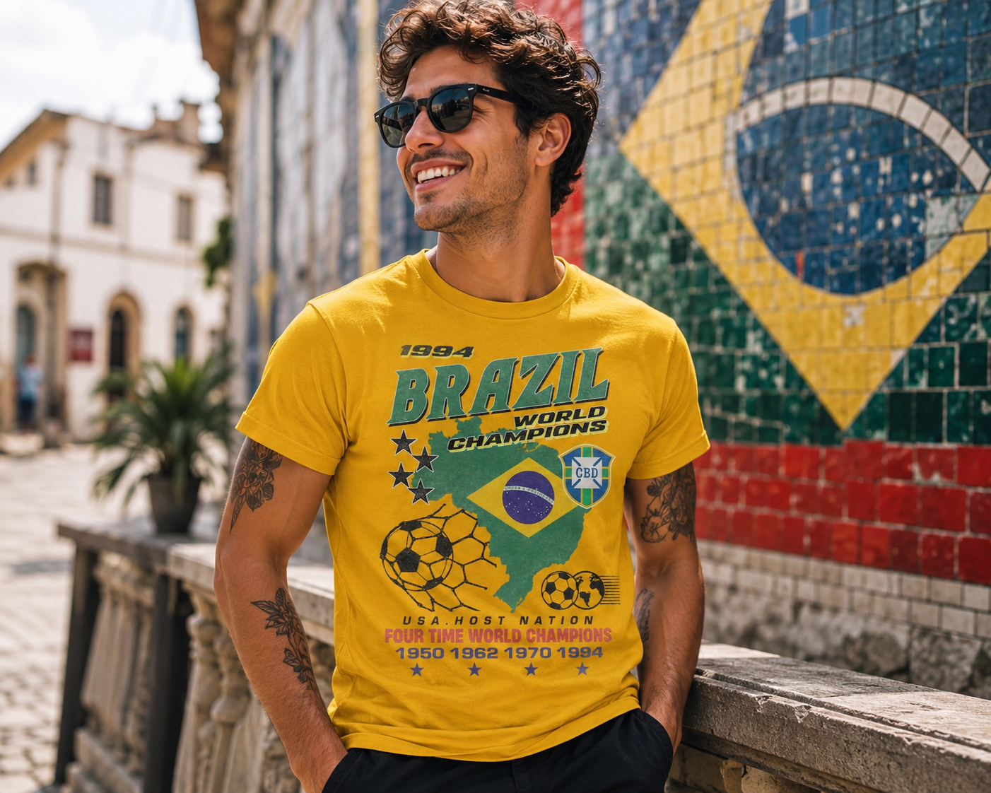 Male model wearing Brazil World Champions gold soccer t-shirt in sunny outdoor futbol setting