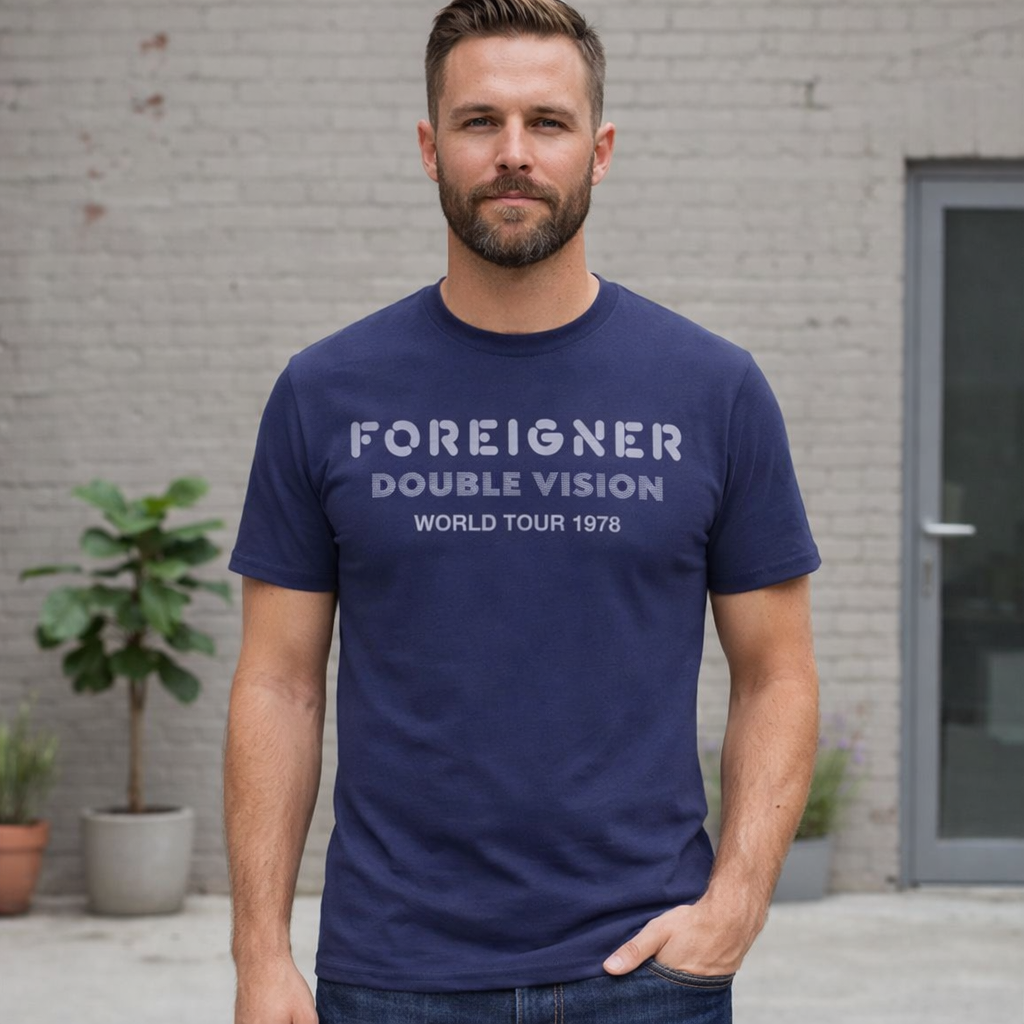 Male model wearing Foreigner Double Vision World Tour 1978 navy t-shirt classic rock band graphic tee