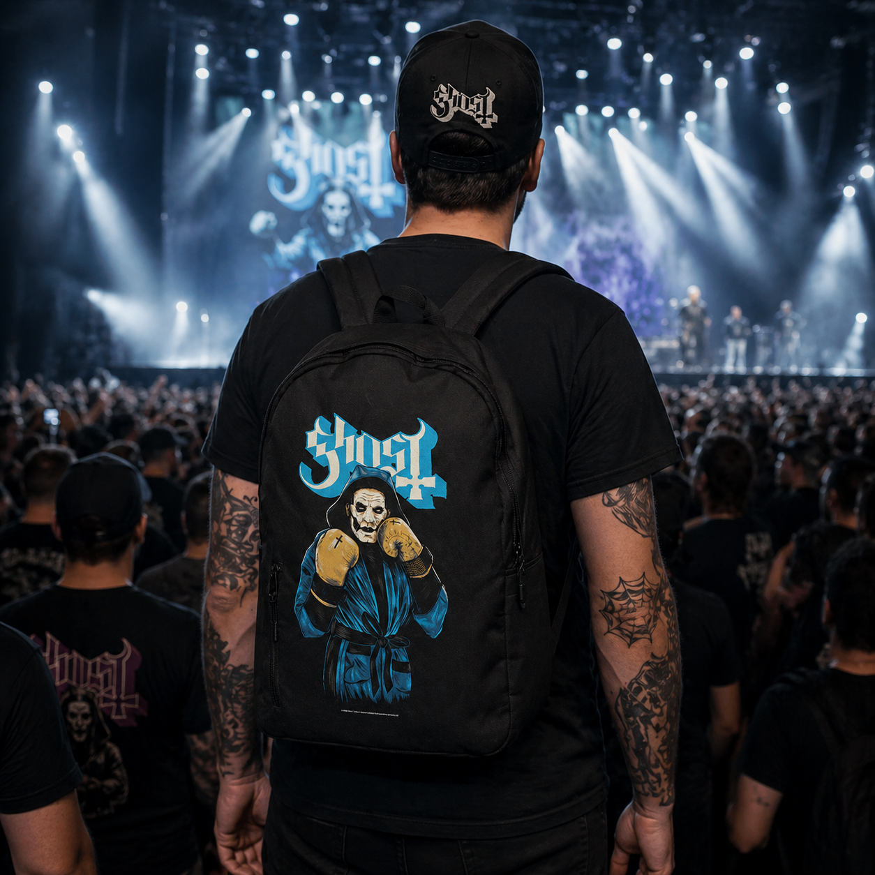 Male model wearing Ghost Prize Fighter backpack at concert showing official band merch in crowd setting