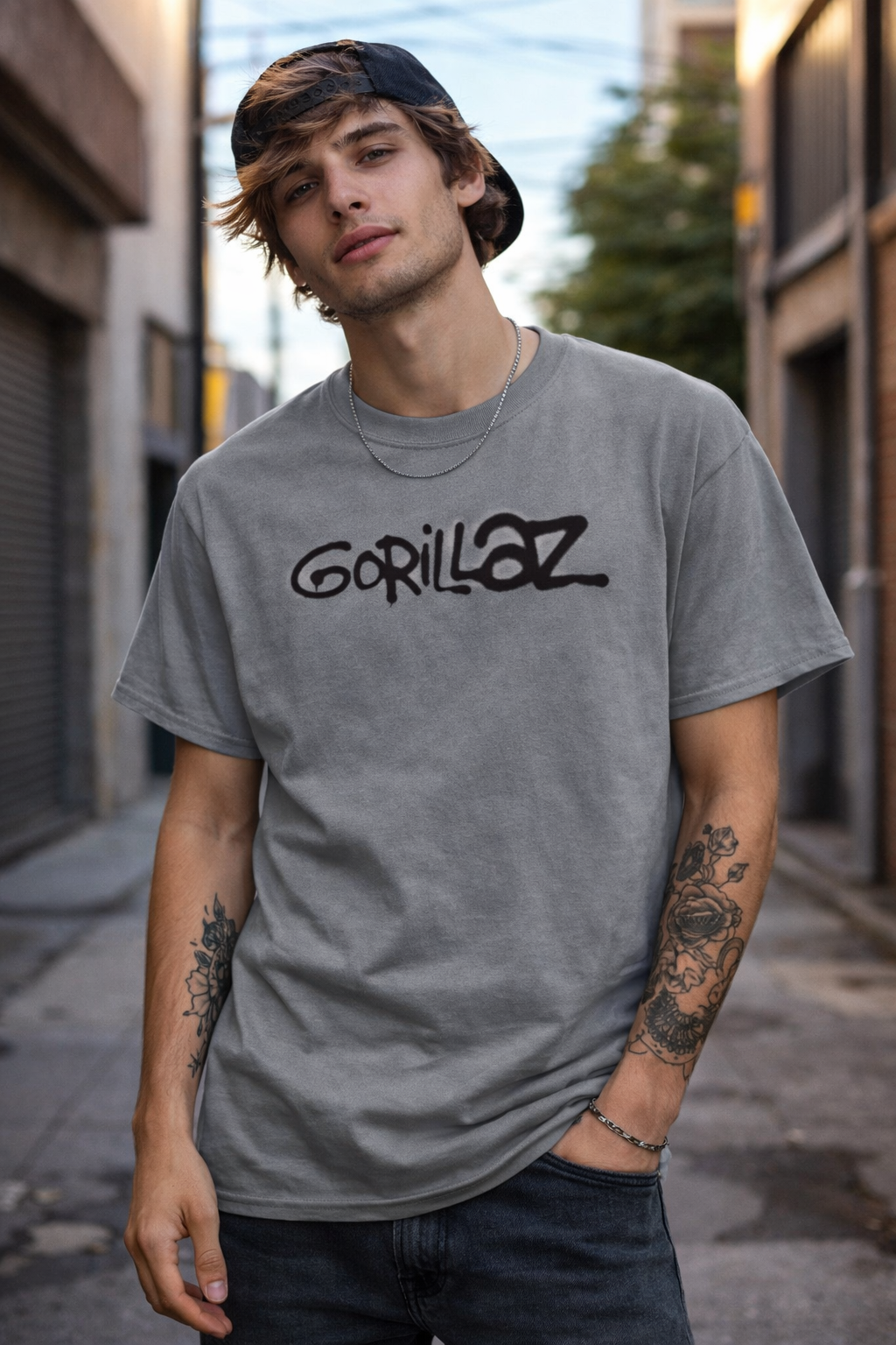 Male model wearing Gorillaz logo graffiti black t shirt with spray paint style design