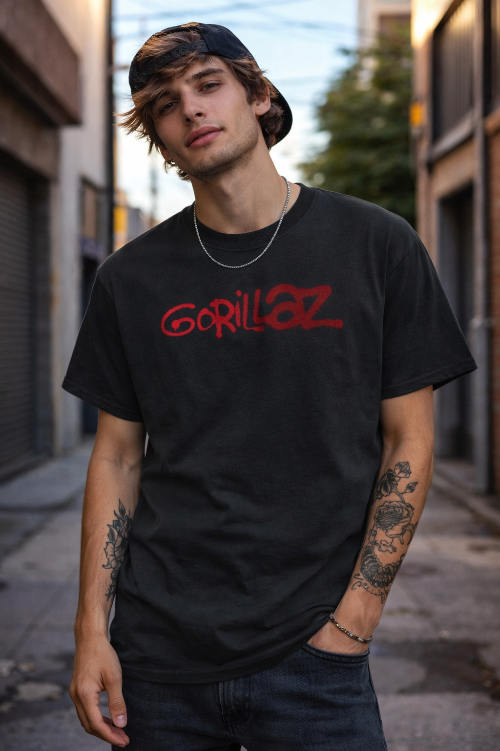 Male model wearing Gorillaz logo graffiti red t shirt on black tee with spray paint design