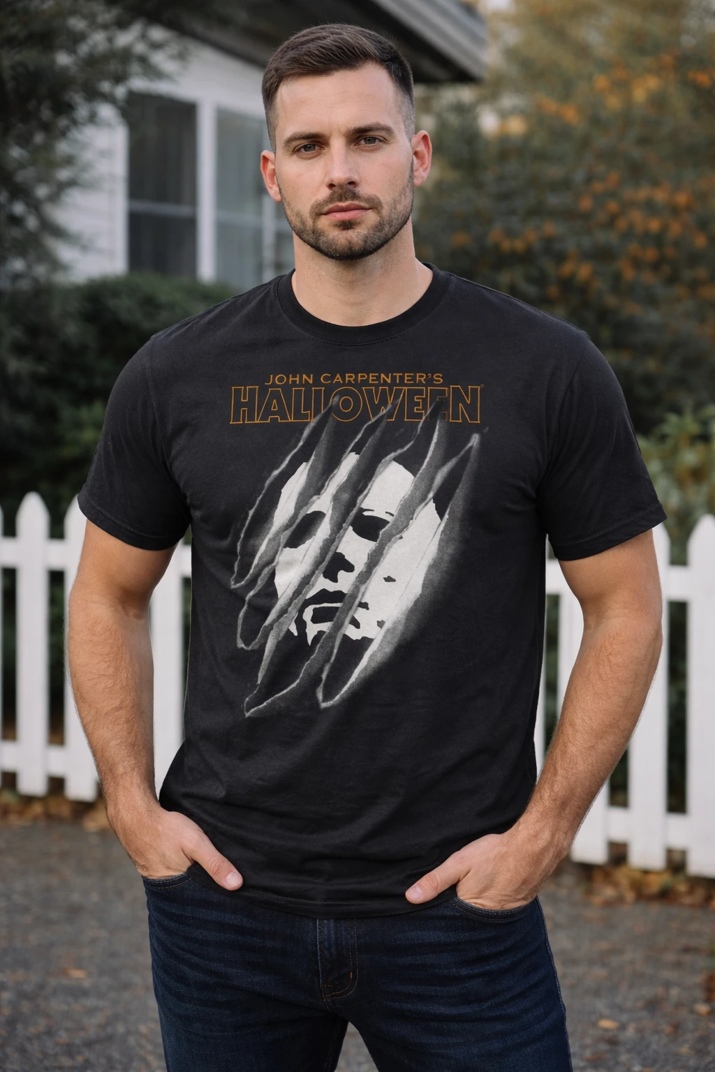 Male model facing forward wearing Halloween torn mask Michael Myers t shirt with distressed horror graphic design