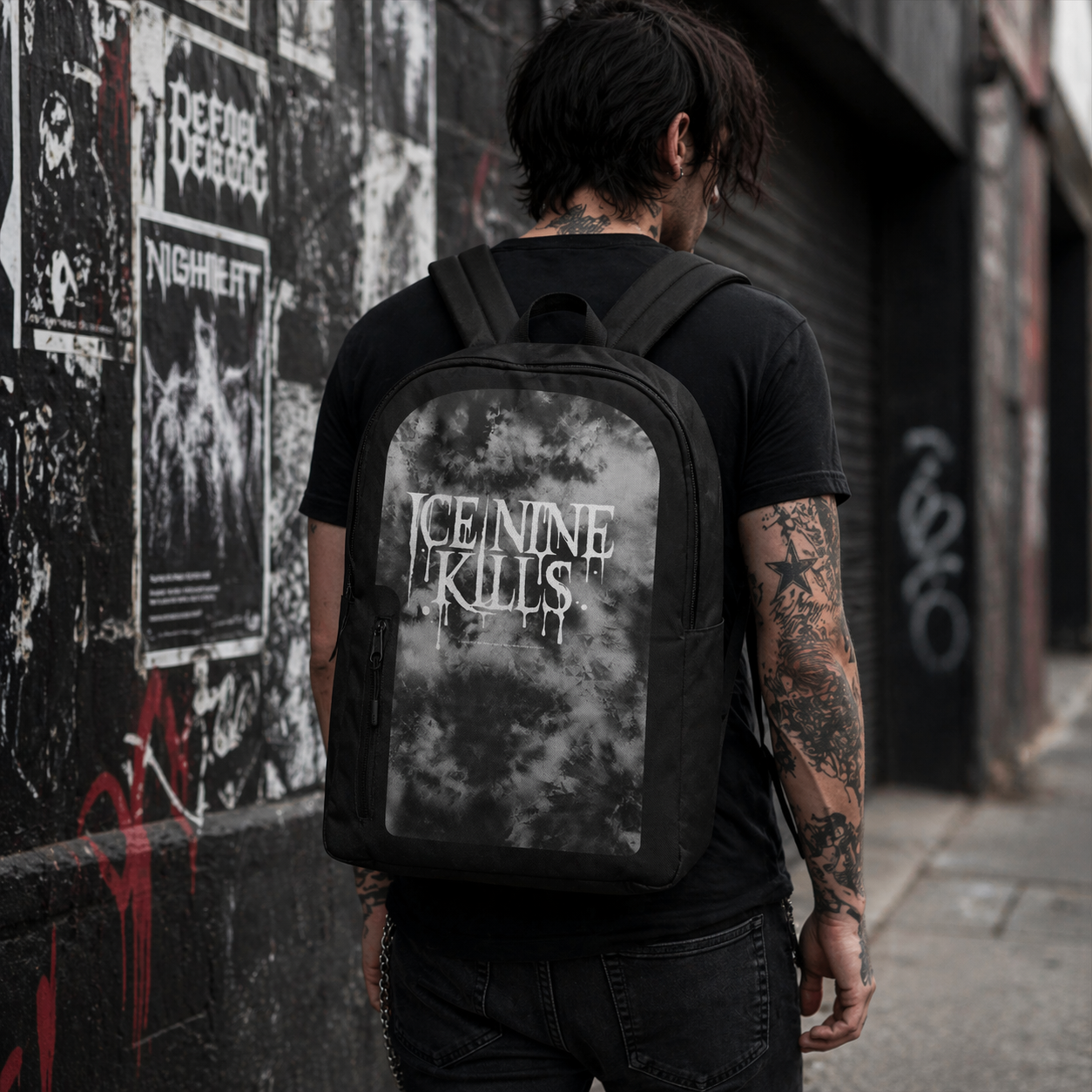 Male model wearing Ice Nine Kills backpack with drippy logo design in urban setting