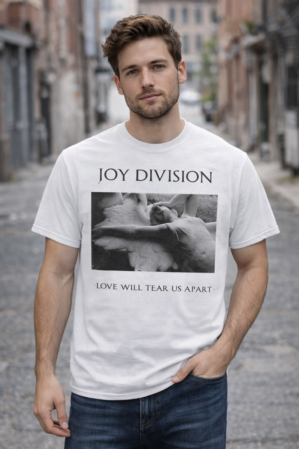 male model wearing Joy Division Love Will Tear Us Apart white t-shirt in urban street setting