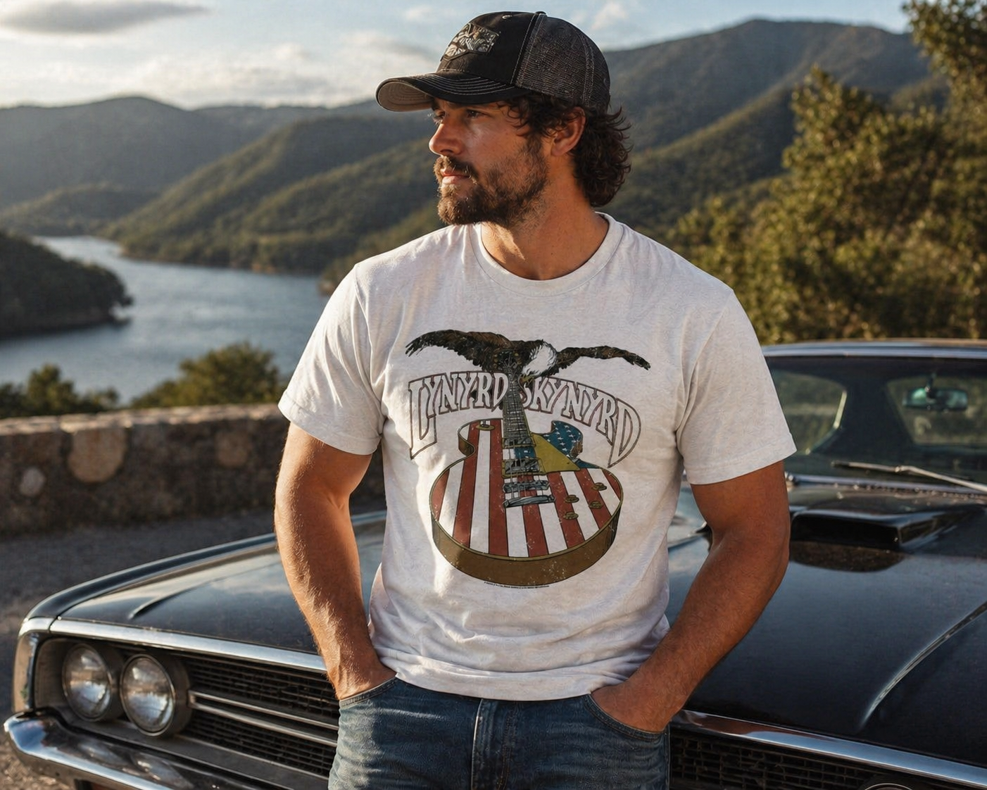 Male model wearing Lynyrd Skynyrd eagle guitar American flag t-shirt at scenic lakeside location