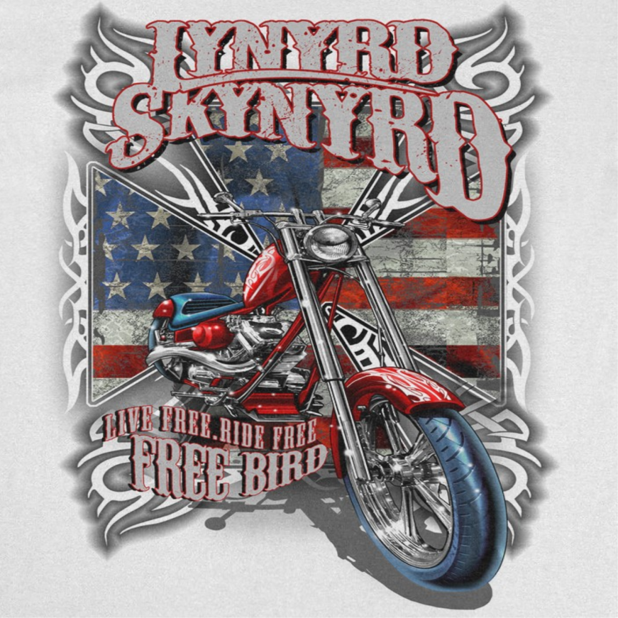 Close-up of Lynyrd Skynyrd Free Bird white t-shirt artwork featuring motorcycle graphic, American flag background, and distressed Southern rock design