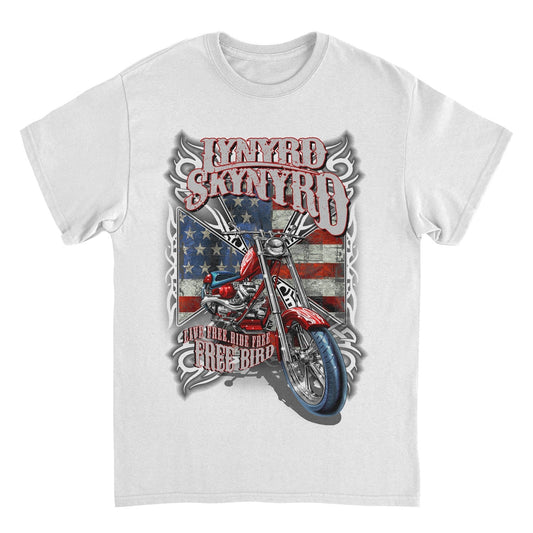 Lynyrd Skynyrd Free Bird white t-shirt featuring motorcycle artwork, American flag background, and Southern rock graphic design