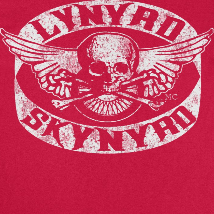 Close-up of the Lynyrd Skynyrd Skull White Red T-Shirt showing distressed white skull and wings artwork on a red Southern rock band tee.