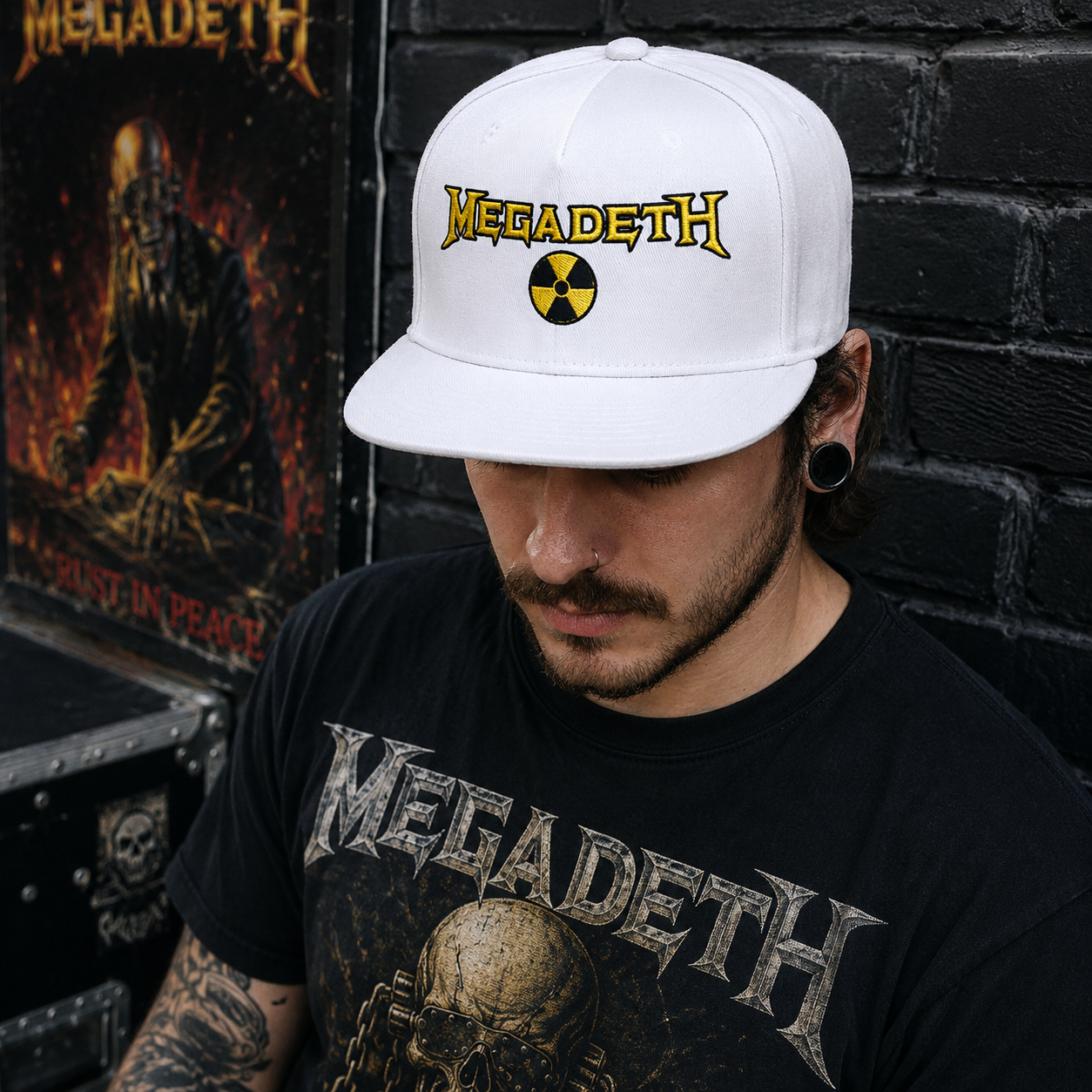 Male model wearing the official Megadeth logo snapback hat in white with premium embroidered logo in an urban rock-inspired setting.