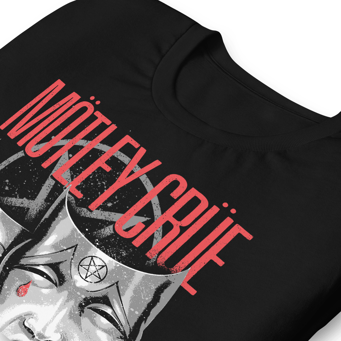 Angled close-up of the officially licensed Mötley Crüe Theatre of Pain black T-shirt featuring the distressed band logo, pentagram graphic, and iconic theatre mask artwork.