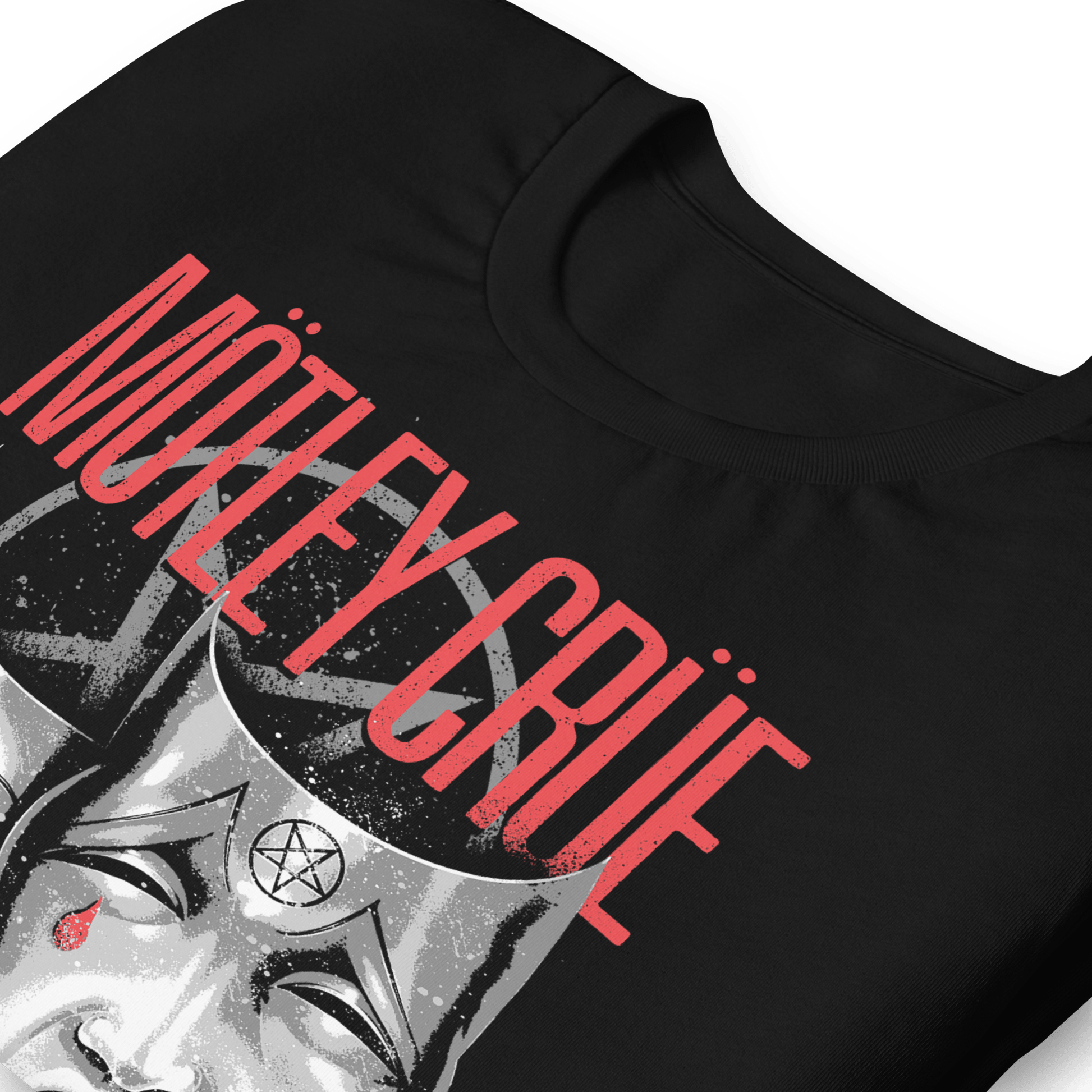 Angled close-up of the officially licensed Mötley Crüe Theatre of Pain black T-shirt featuring the distressed band logo, pentagram graphic, and iconic theatre mask artwork.