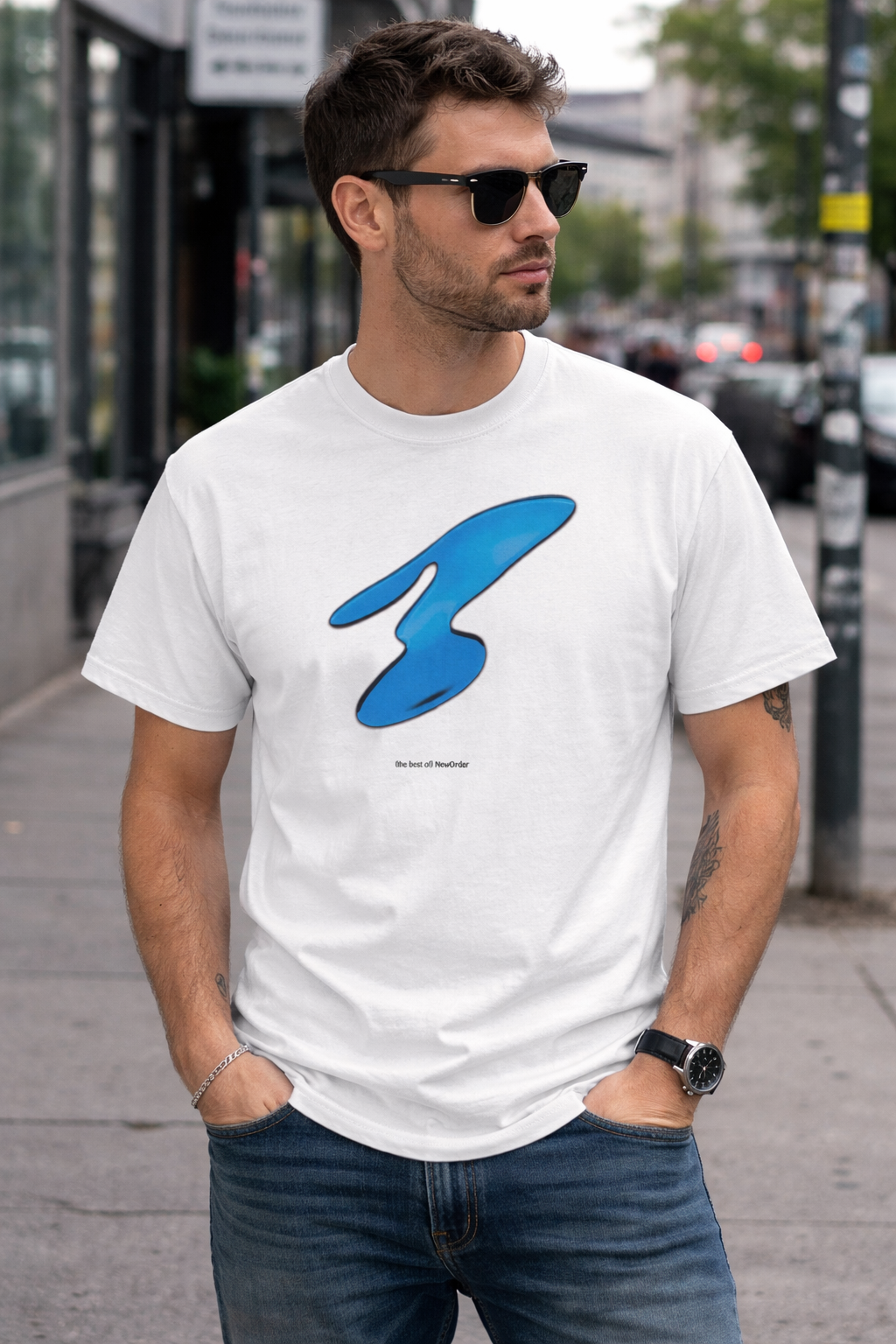Male model wearing New Order Best Of t shirt with greatest hits album design in urban street setting casual outfit