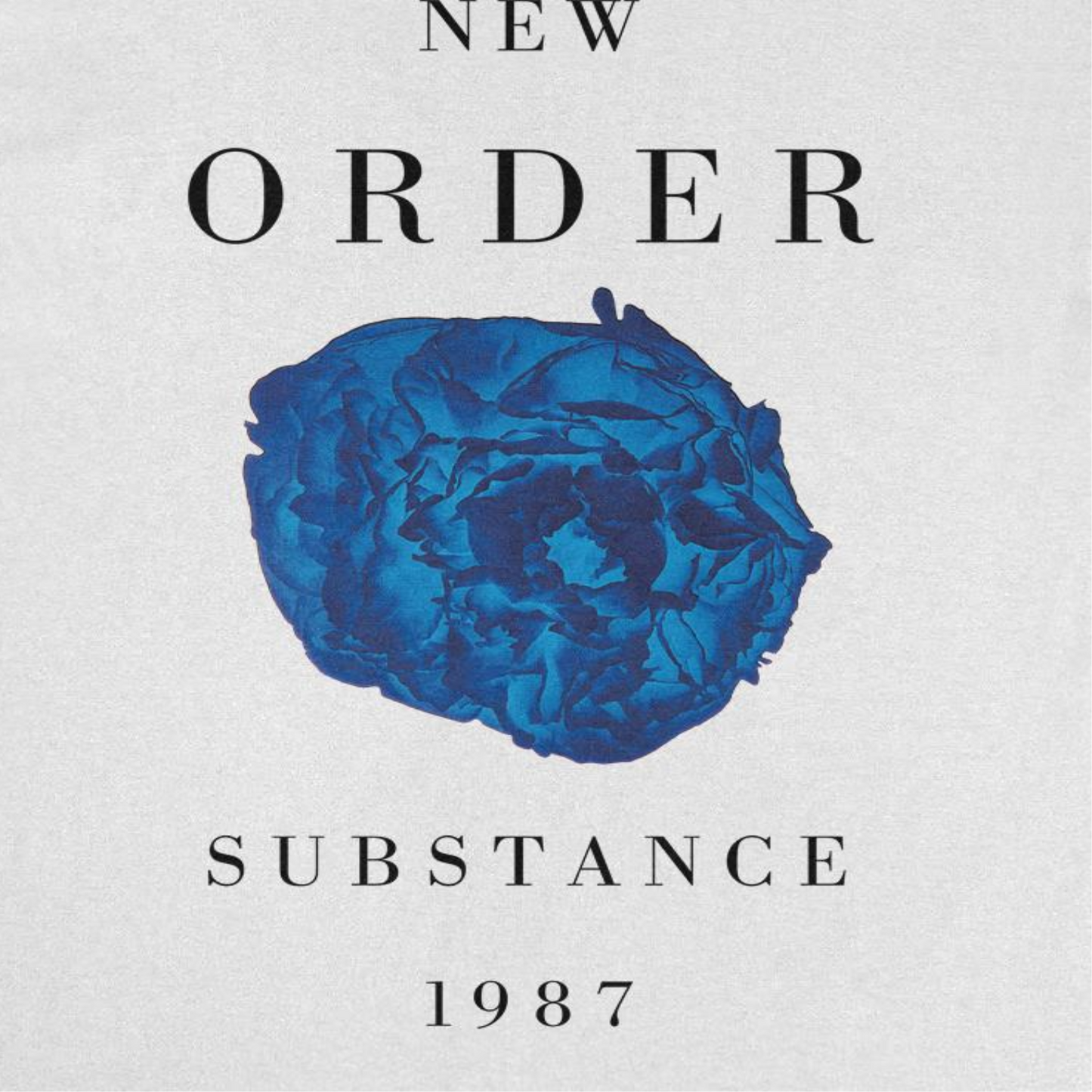 Close-up of New Order Substance t-shirt design featuring blue flower artwork from the 1987 album