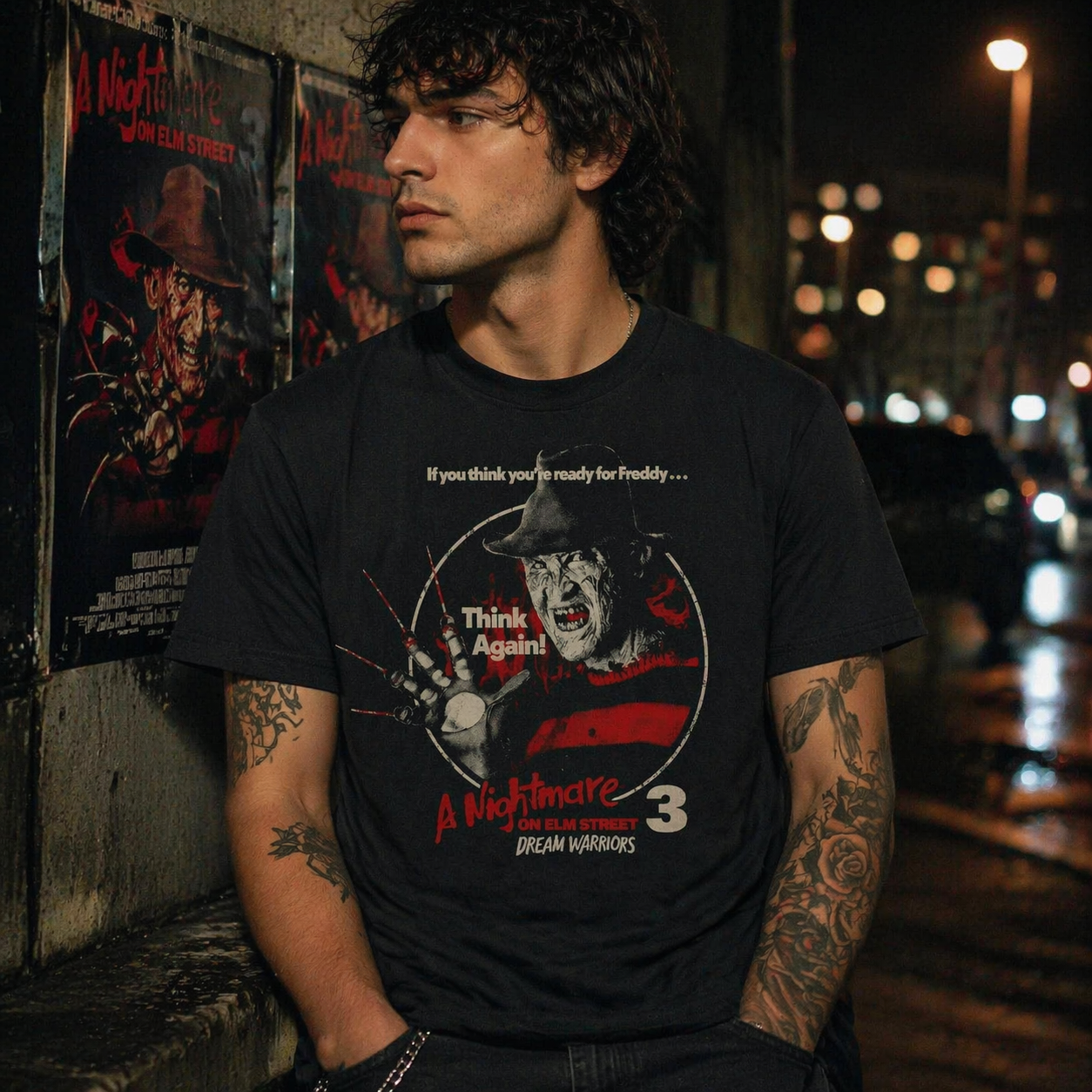 male model wearing Nightmare on Elm Street Dream Warriors Freddy Krueger black t shirt in urban night setting