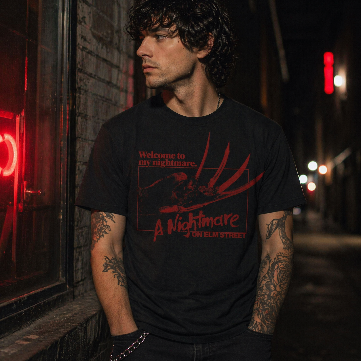male model wearing Nightmare on Elm Street Welcome to My Nightmare Freddy Krueger black t shirt in dark urban night setting