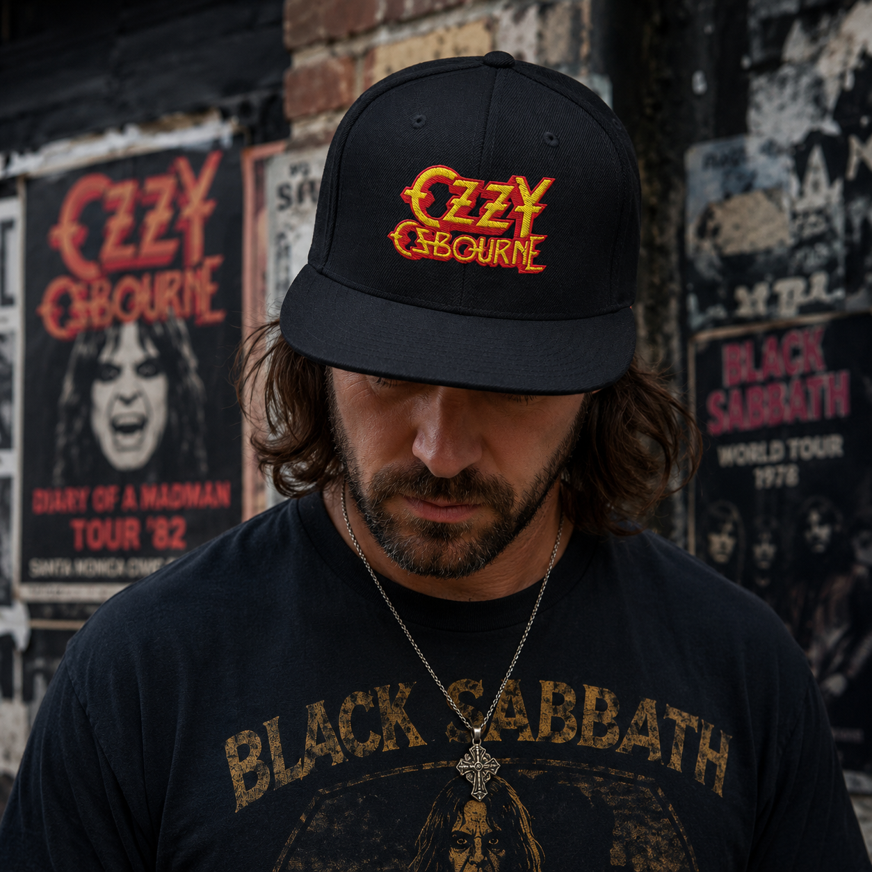 Male model wearing an official Ozzy Osbourne black embroidered snapback hat with a vintage rock-inspired streetwear look against an urban concert poster backdrop