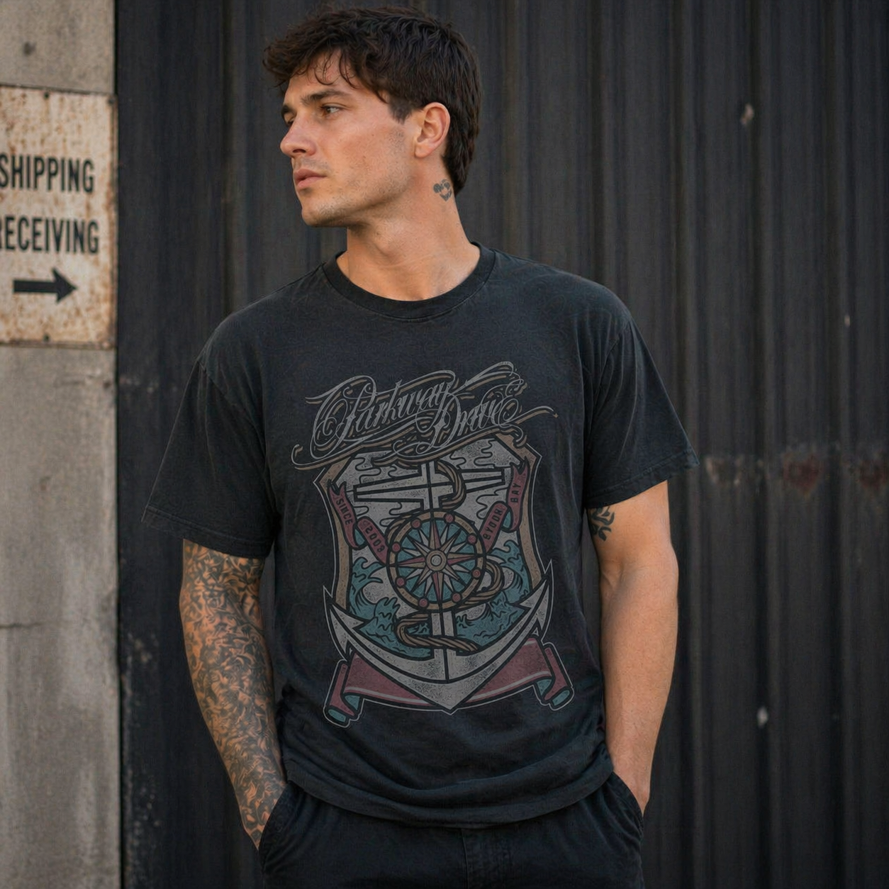 male model wearing Parkway Drive Byron Bay 2003 black band t shirt with anchor compass design metalcore merch