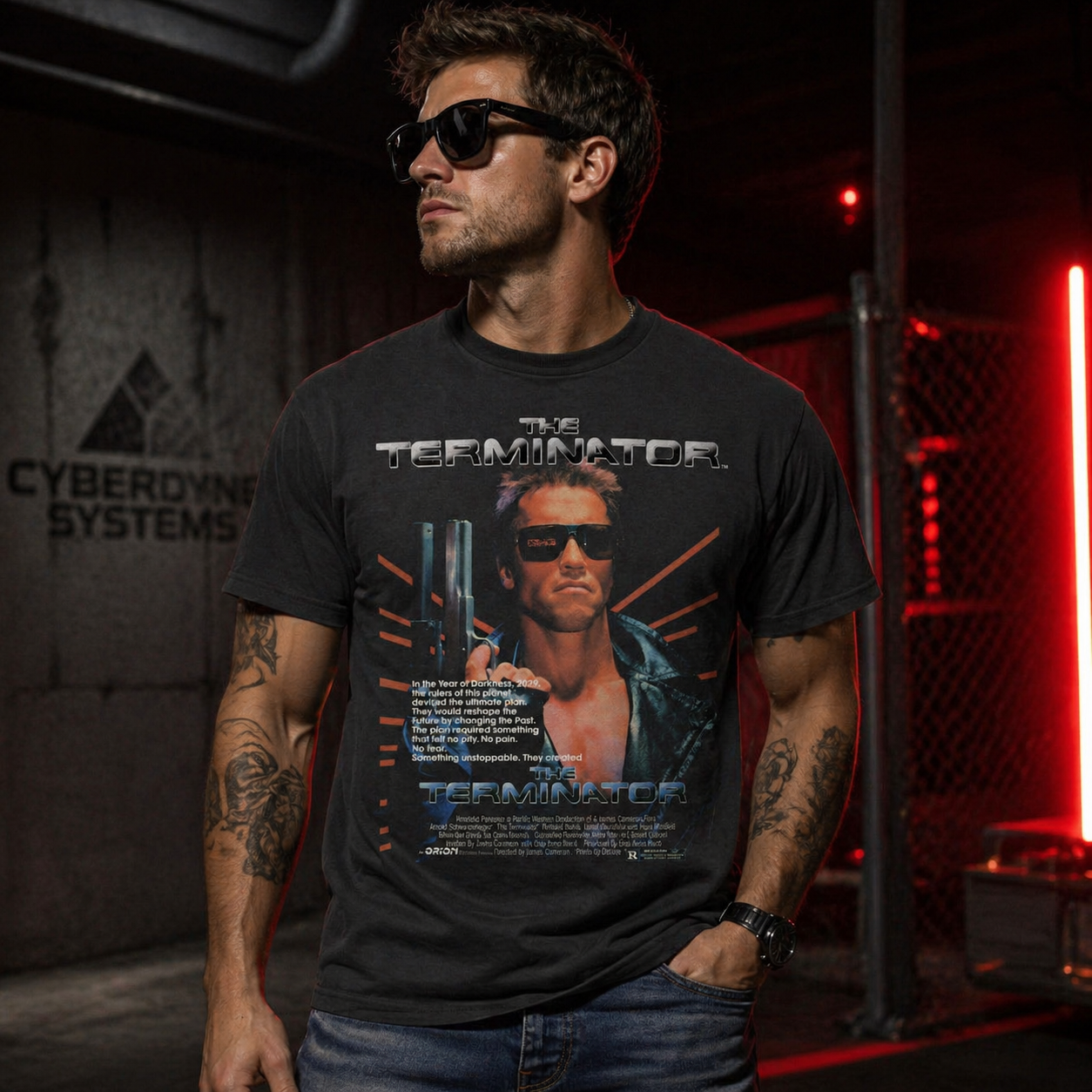 Male model wearing Terminator T-800 Arnold Schwarzenegger t shirt in industrial setting with red lighting