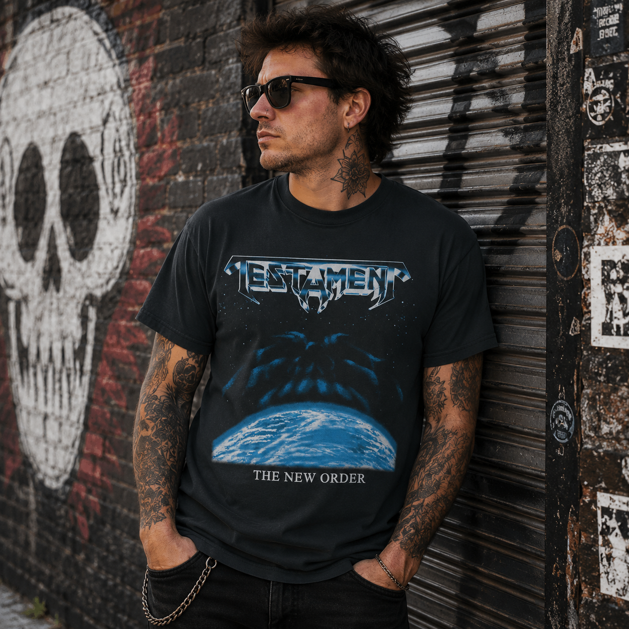 Male model wearing officially licensed Testament The New Order thrash metal band t-shirt in an urban graffiti alley with heavy metal streetwear style.