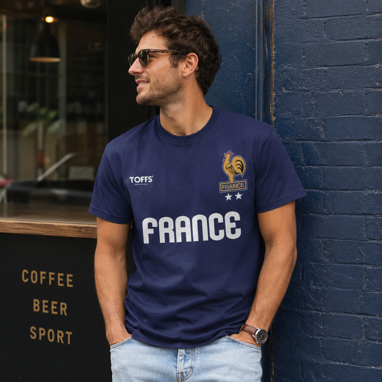 Male model wearing Toffs Retro Soccer France navy t-shirt with rooster crest and bold France lettering