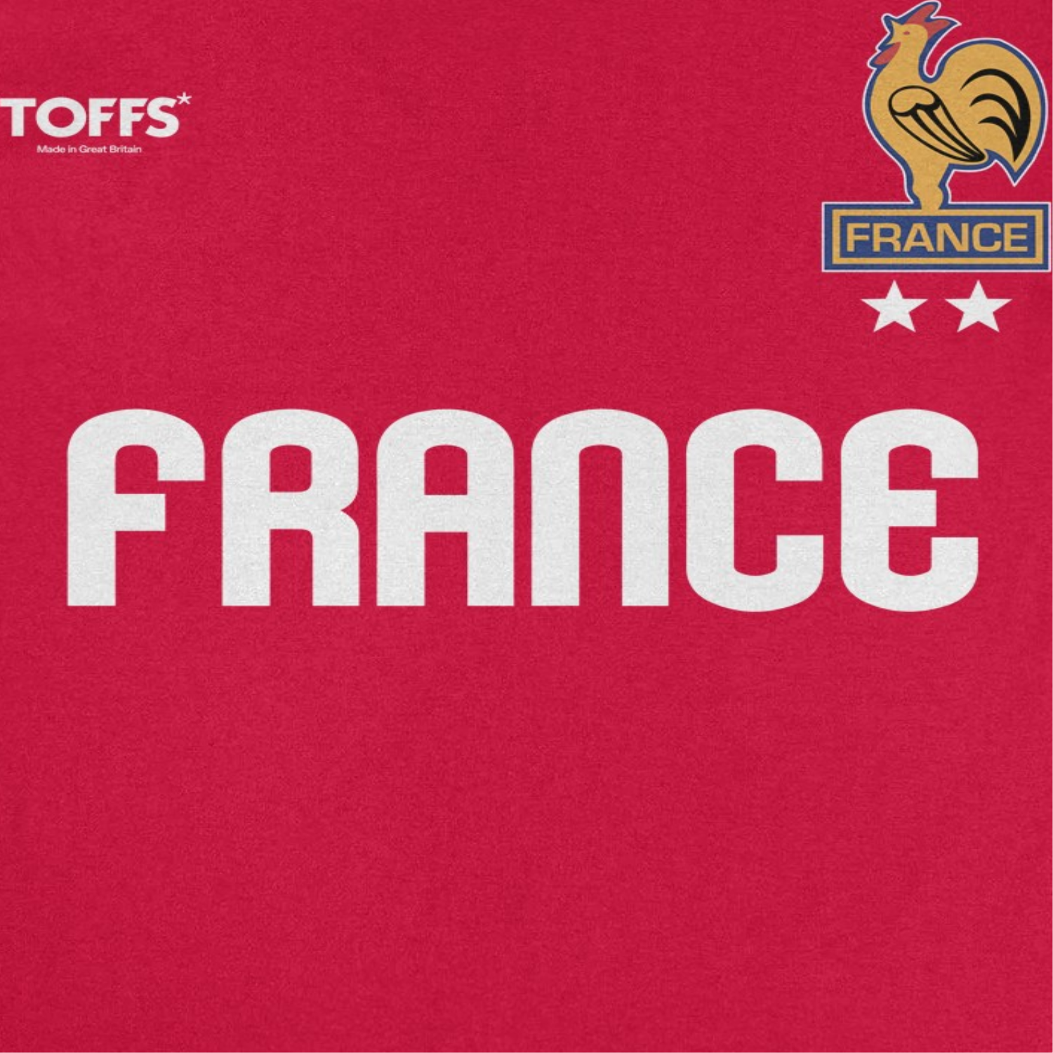 Close-up of Toffs Retro Soccer France red t-shirt featuring bold France lettering, rooster crest artwork, and vintage futbol style