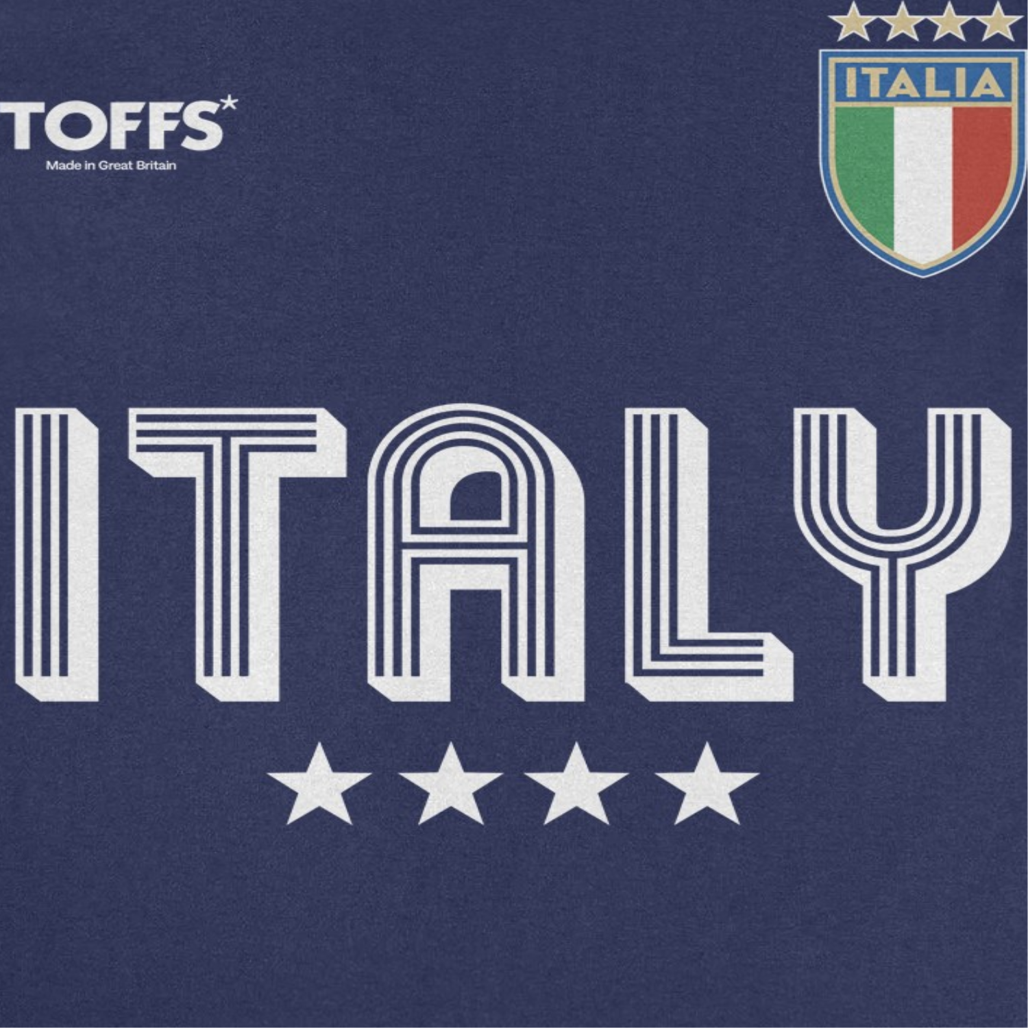 Close-up of the Toffs Retro Soccer Italia Navy T-Shirt featuring bold ITALY lettering, Italia crest, and vintage-inspired soccer graphics on a navy blue shirt.