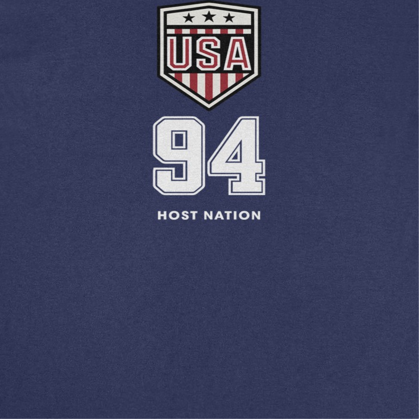 Close-up of Toffs Retro Soccer USA 94 Host Nation navy t-shirt graphic with USA shield and vintage soccer design